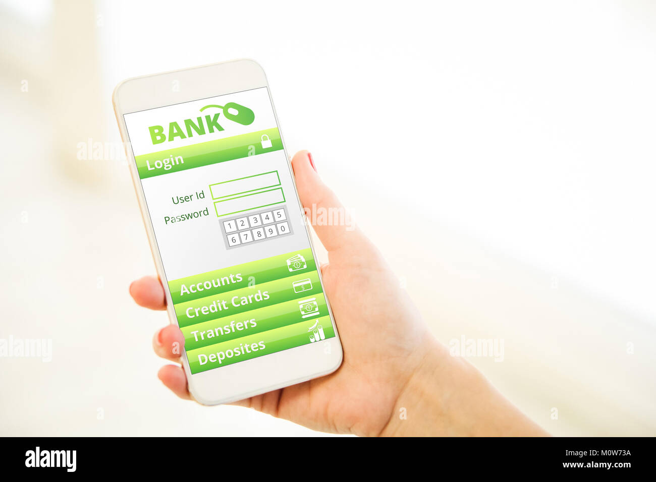 Woman holding a pink gold generic smartphone showing mobile banking app Stock Photo