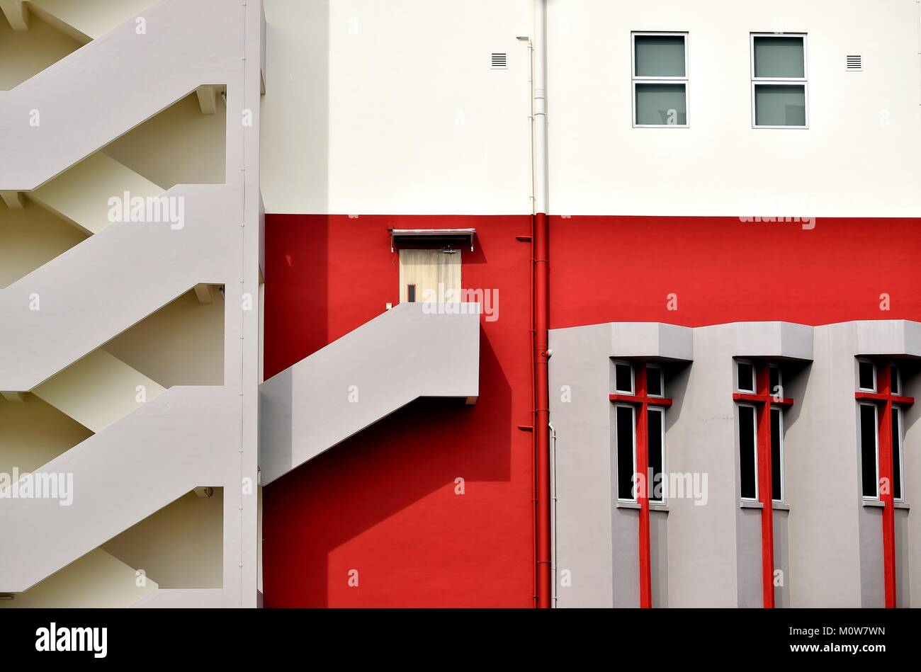 Bold exterior of a modern factory with exterior staircase in Singapore Stock Photo