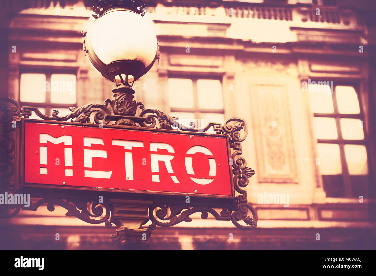Art nouveau Paris subway underground entrance sign on a beautiful background, vintage style. December 2011. Stock Photo