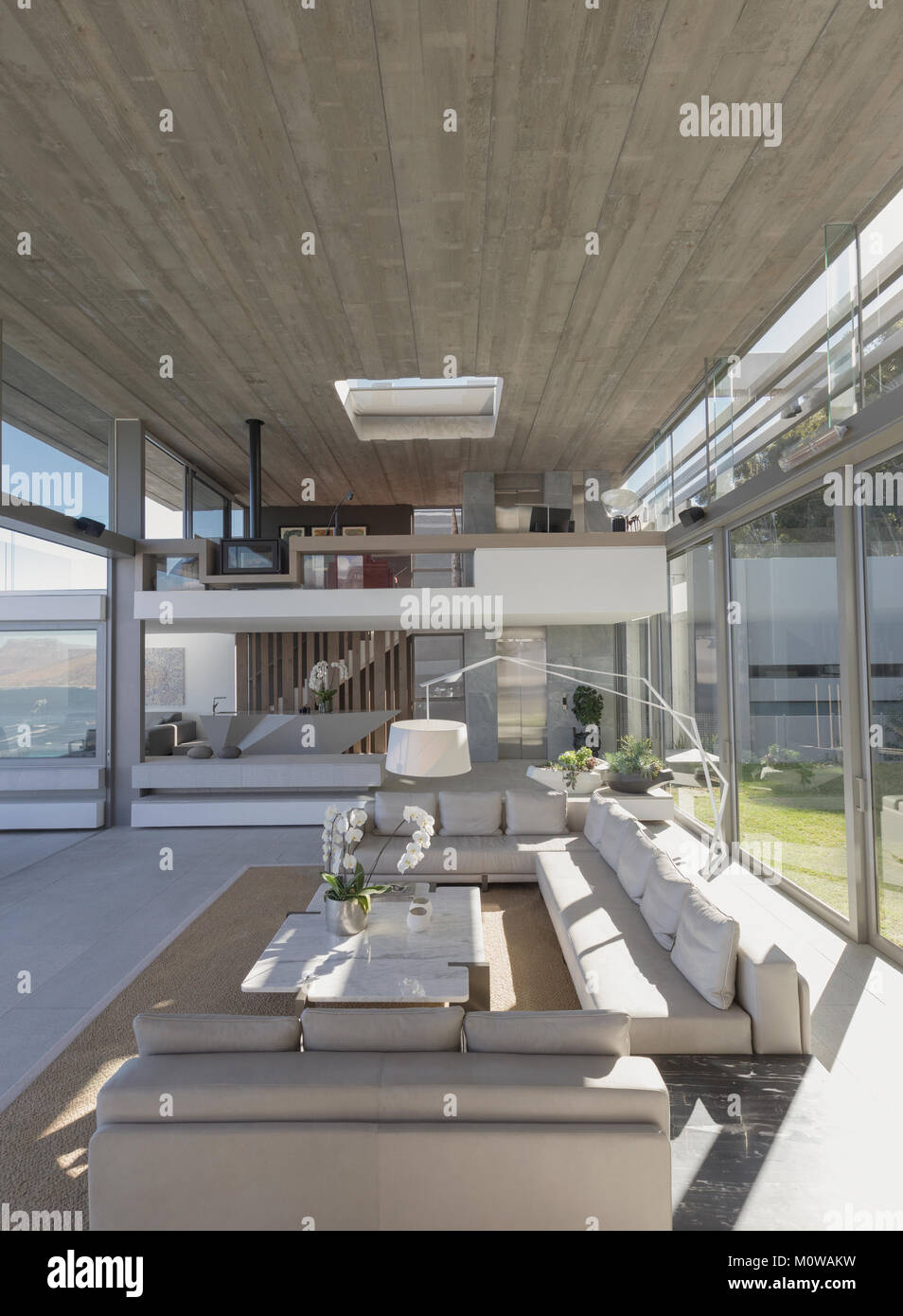 Sunny modern, luxury home showcase interior living room Stock Photo - Alamy