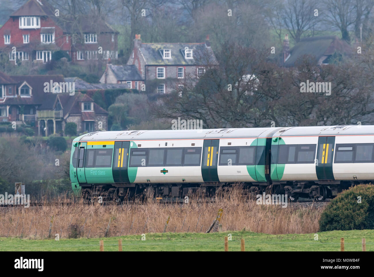 Southern Rail train travelling through the South Downs Arun district countryside in West Sussex, UK. Train travel concept. Travelling by train. Stock Photo