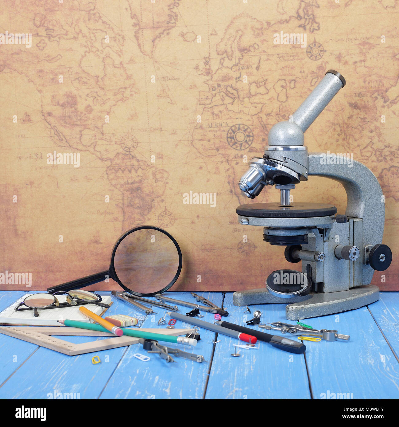 Science and education - Desktop of the scientist map and blue wood ...