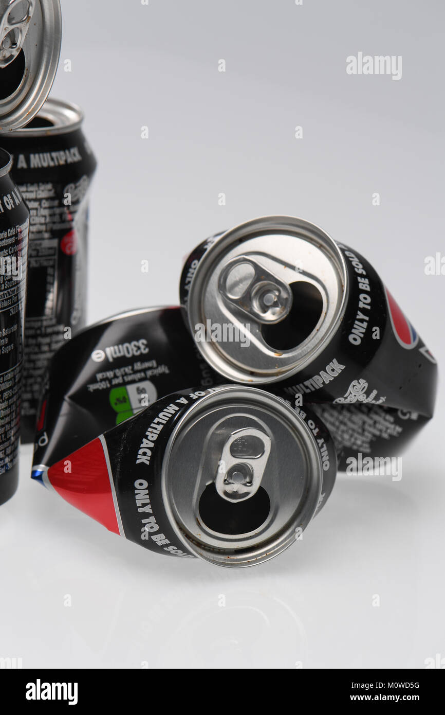 A pile of Pepsi max cans ready for recycling on a white background. Stock Photo