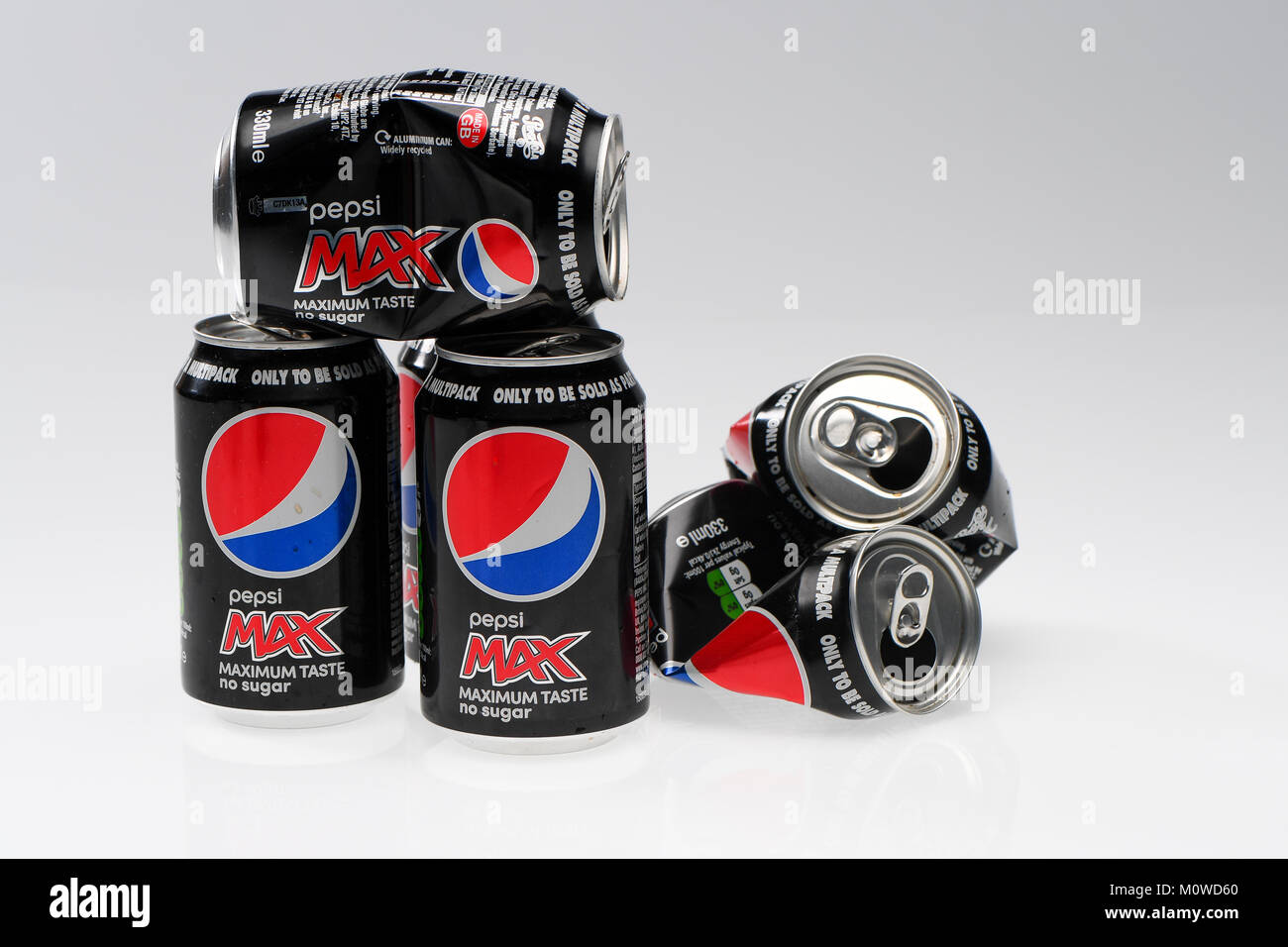 A pile of Pepsi max cans ready for recycling on a white background. Stock Photo