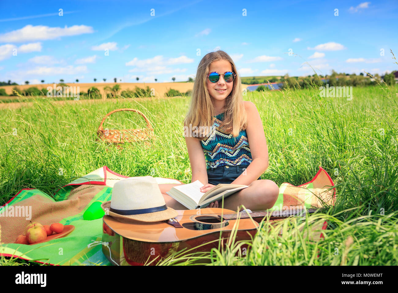 Outdoor portrait of young girl with a guitar Stock Photo - Alamy