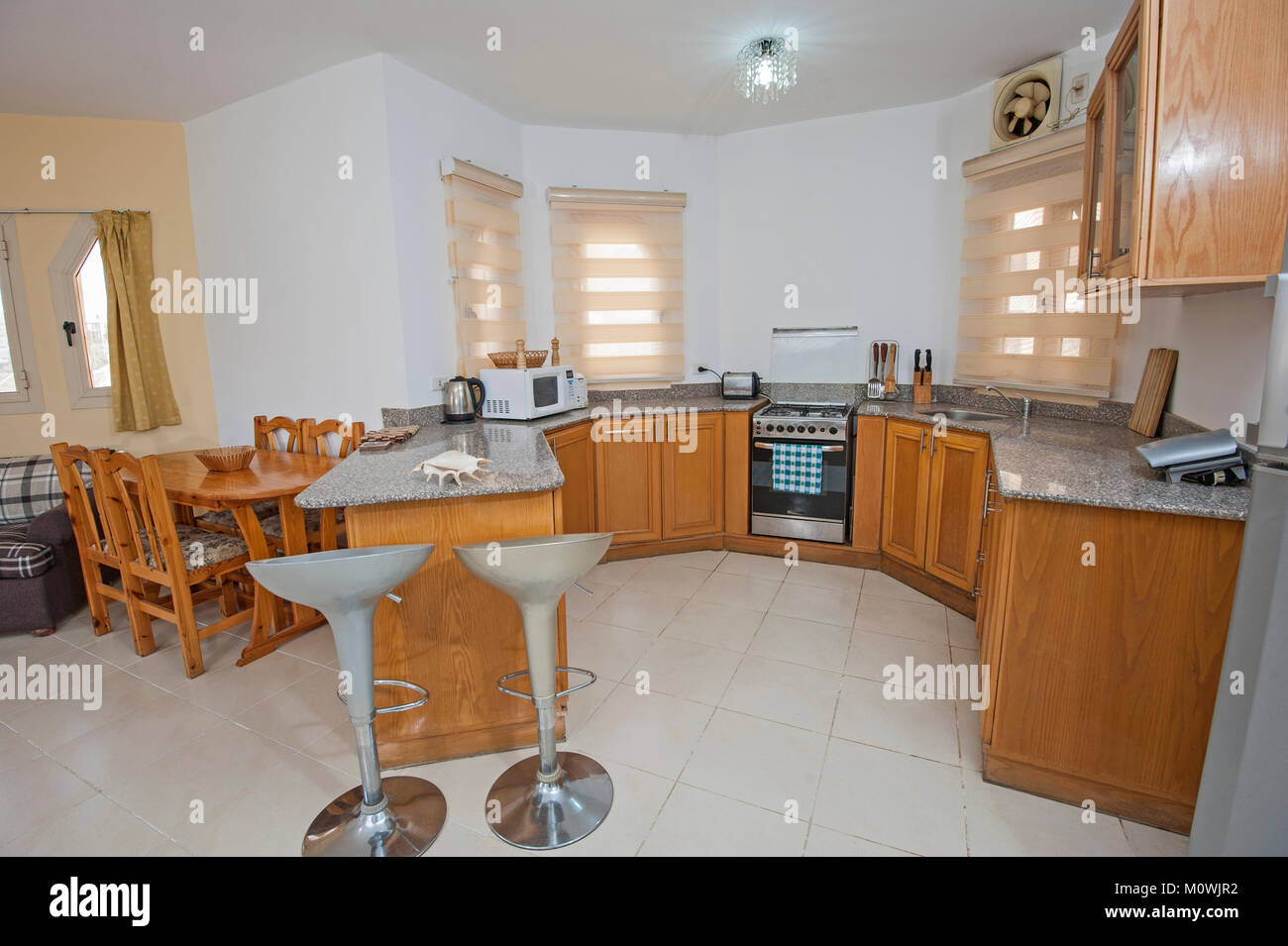 Interior decor kitchen design with appliances and furnishings in luxury show home apartment Stock Photo