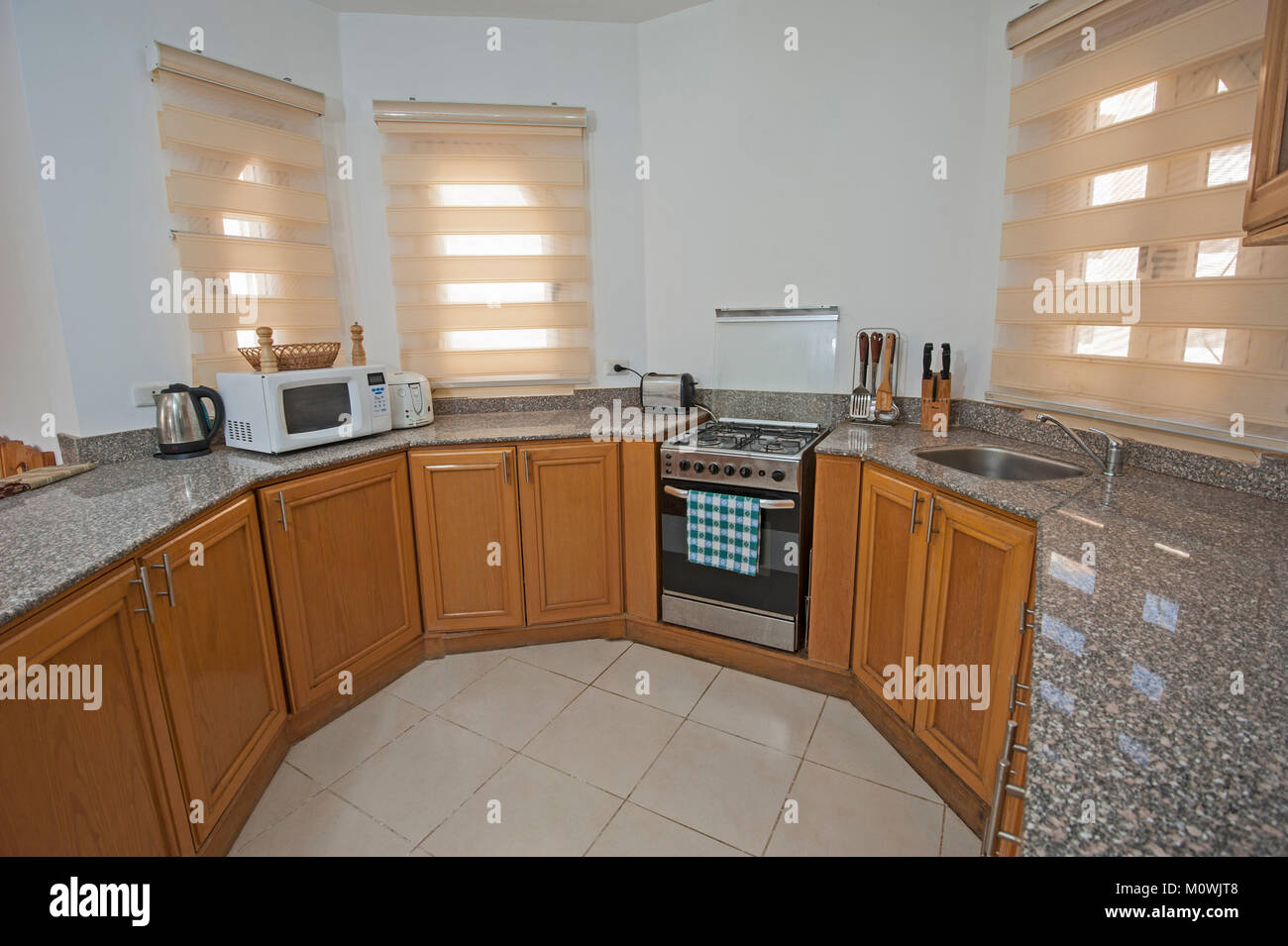 Interior decor kitchen design with appliances and furnishings in luxury show home apartment Stock Photo