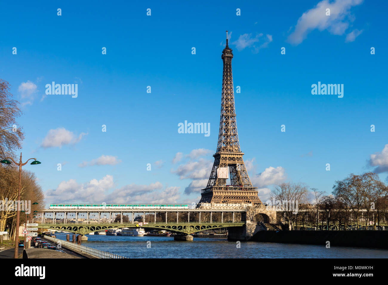 Eiffel Tower and Paris metro bridge with its blue sky Stock Photo Alamy