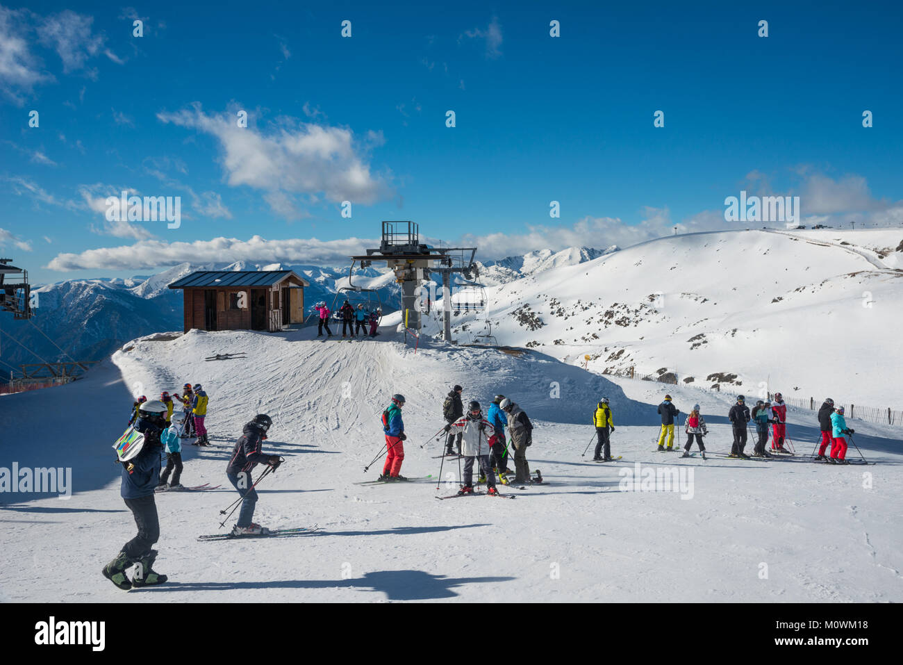 Skiers and snowboarders at the top of a chair lift, Grandvalaria ski ...