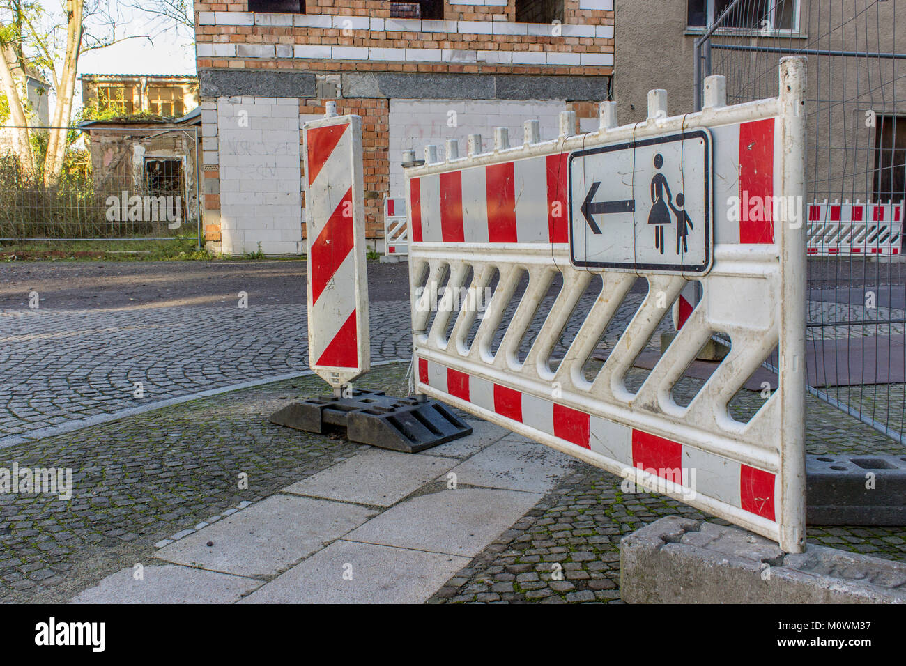 Construction site sign in the barrier at a road Stock Photo - Alamy