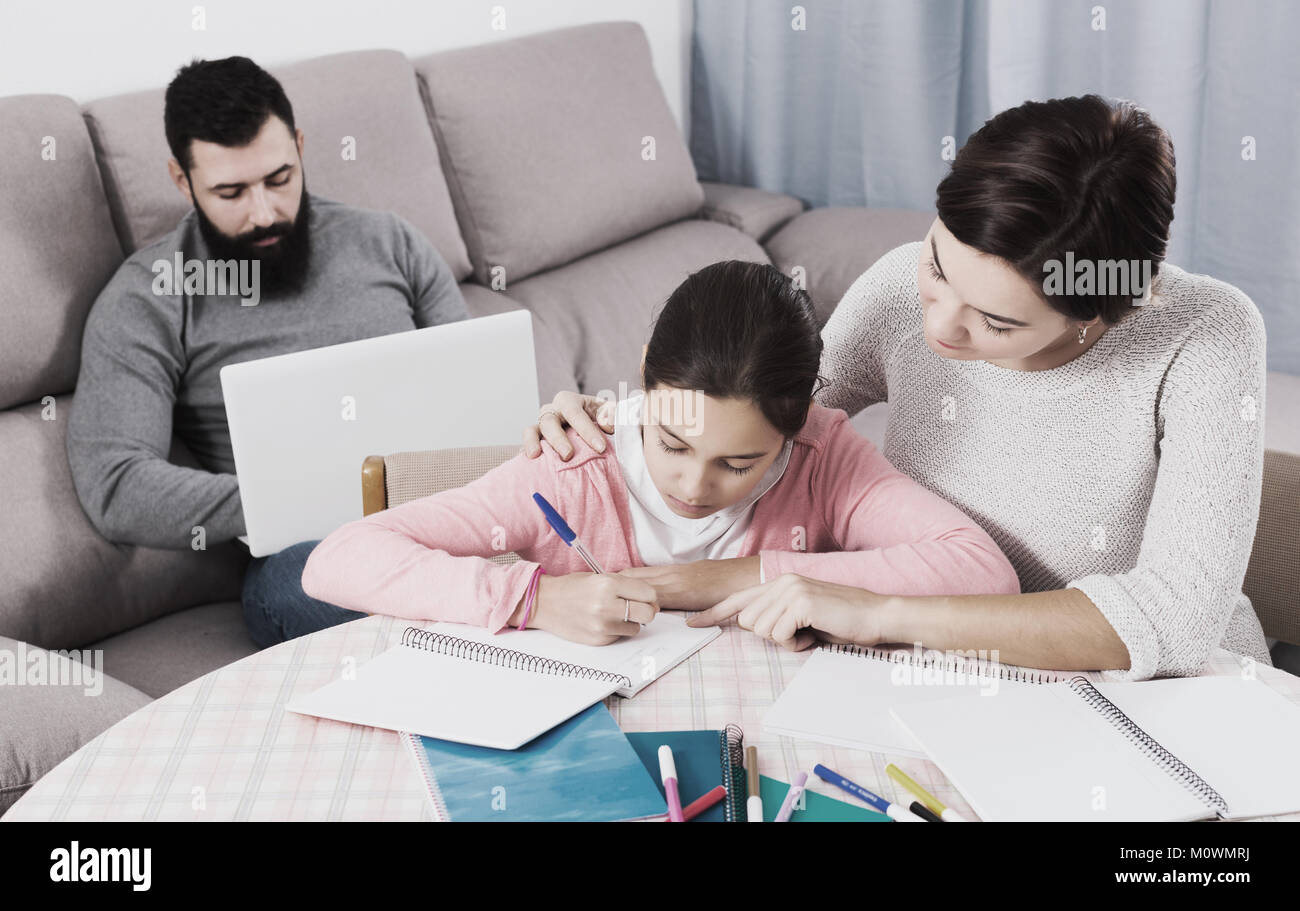 Mother Helping Her Little Child To Do Homework At Home Stock Photo Alamy mother-helping-her-little-child-to-do-homework-at-home-stock-photo-alamy