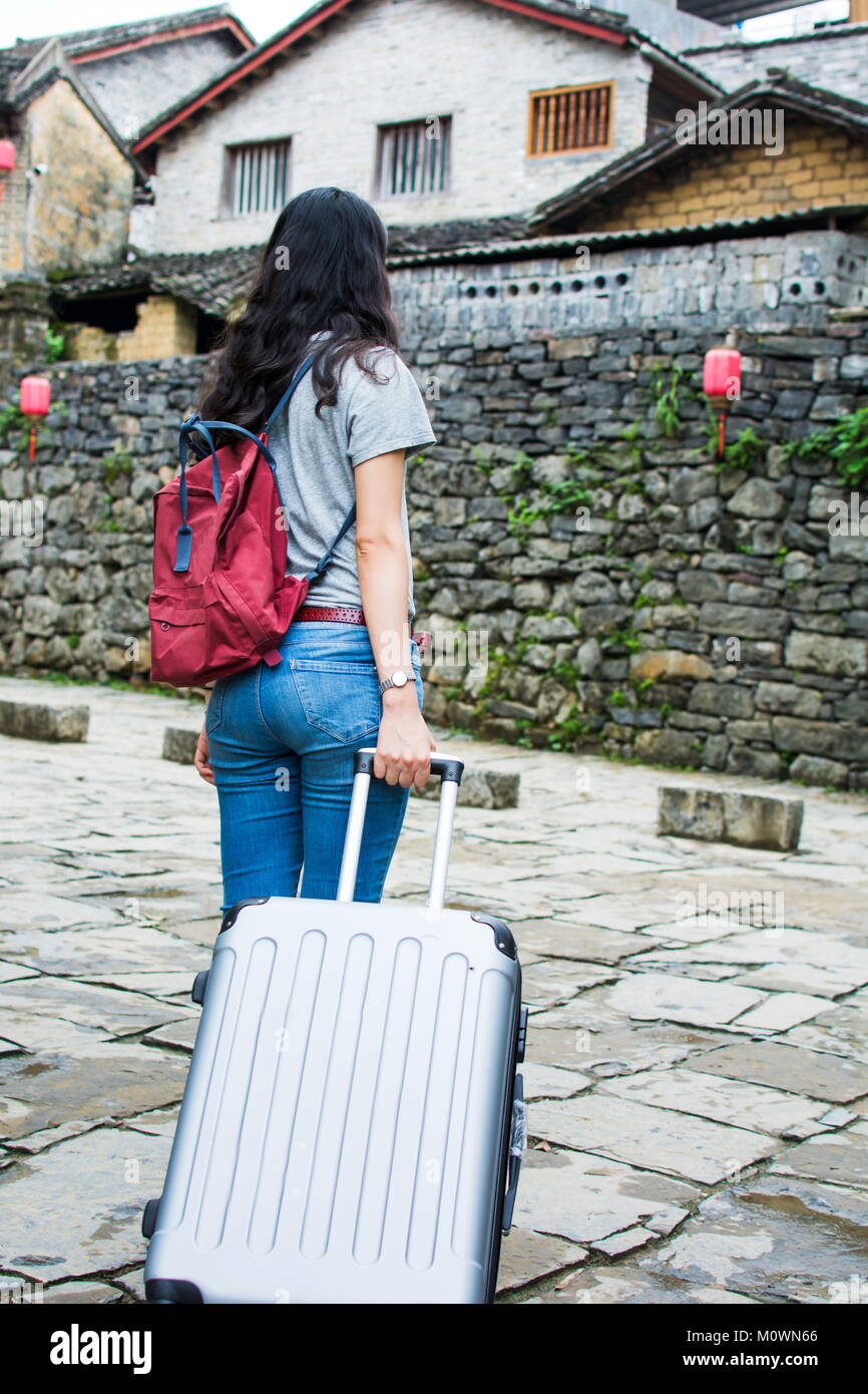girls pull along suitcase