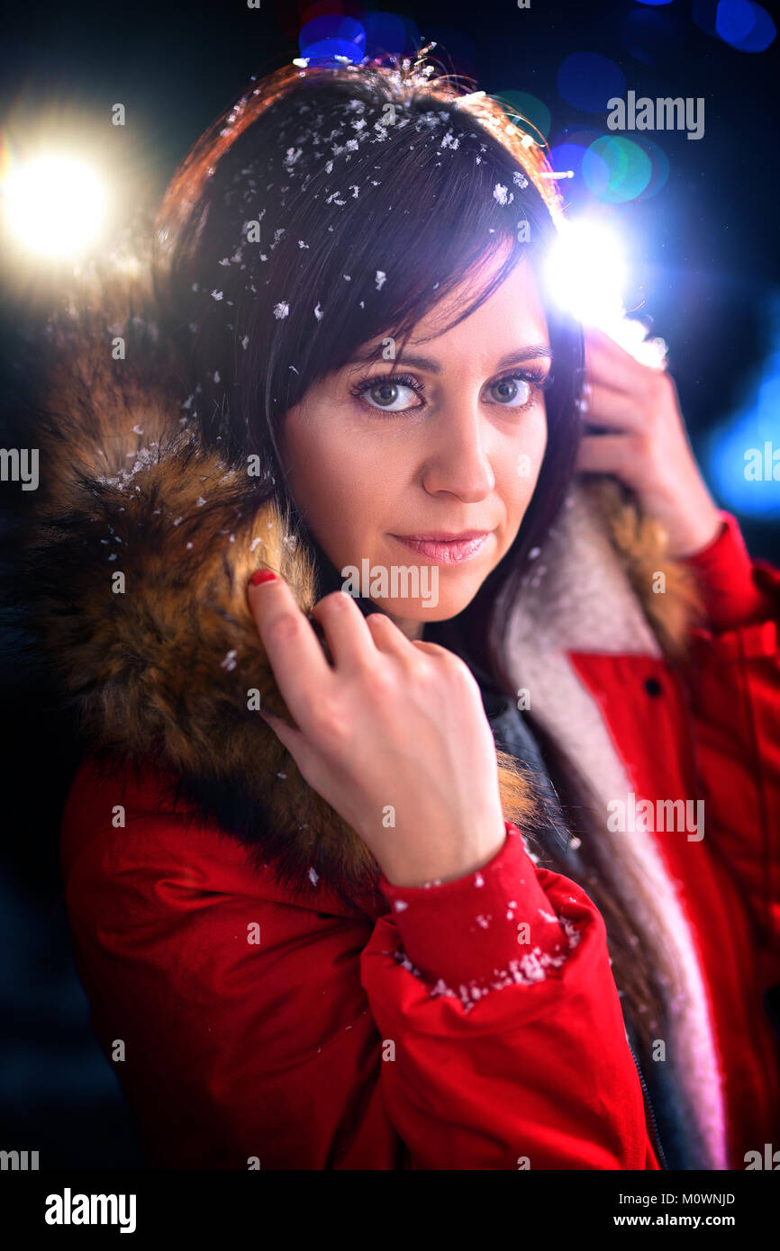 A cheerful young girl wearing a winter jacket Stock Photo - Alamy