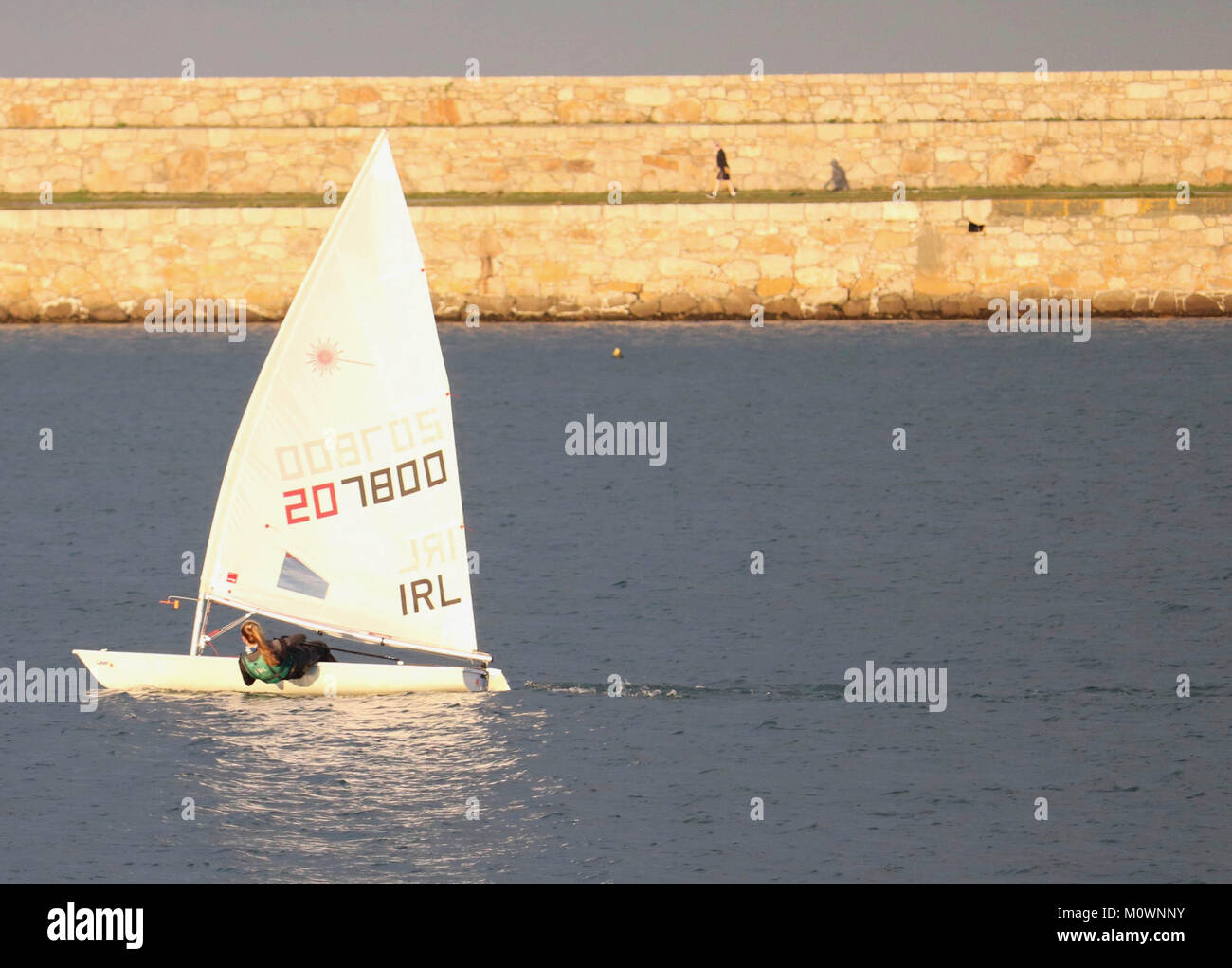 A dinghy at sail in Dun Laoghaire Harbour. Stock Photo