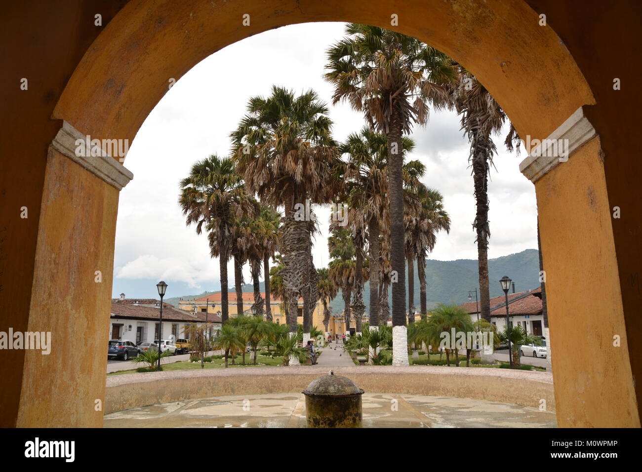 View through an archway on Plaza des Armas in Antigua, Guatemala Stock Photo