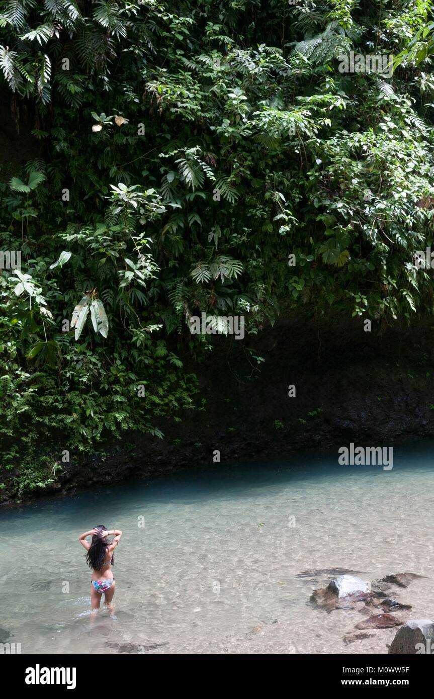 Costa Rica,Alajuela Province,La Fortuna,woman in the river Catarata de la Fortuna Stock Photo