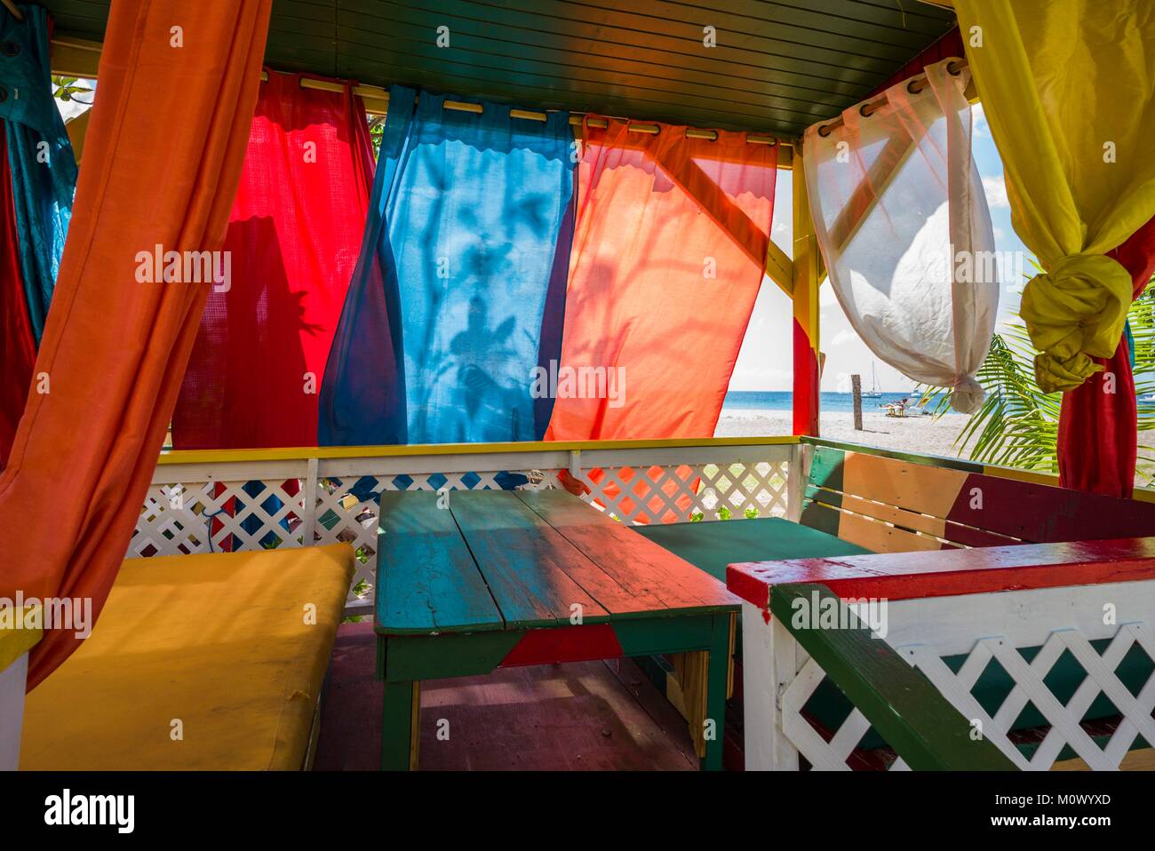 St. Kitts and Nevis,Nevis,Pinneys Beach,beach lounge with curtains ...