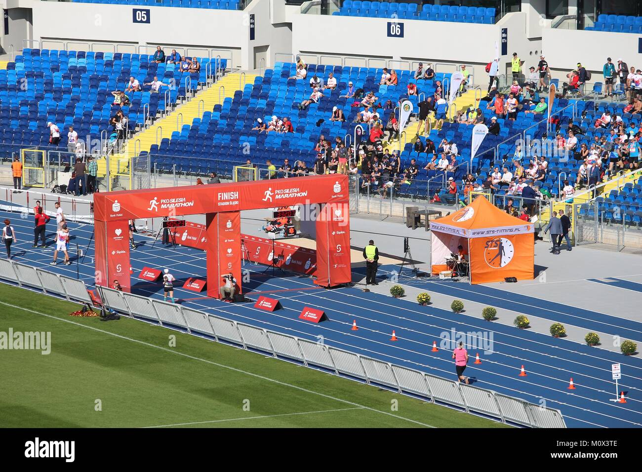 KATOWICE, POLAND - OCTOBER 1, 2017: Runners finish the PKO Silesia Marathon at Silesian Stadium in Katowice, Poland. The marathon had 2,500 participan Stock Photo