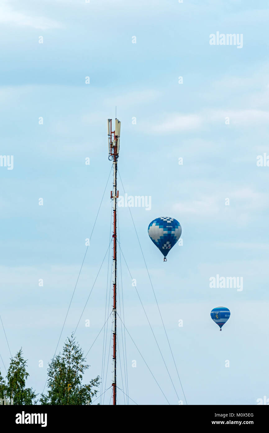 Minsk, Belarus - 10 September 2017: Two balloons, flying around the mast with receiving and transmitting equipment Stock Photo