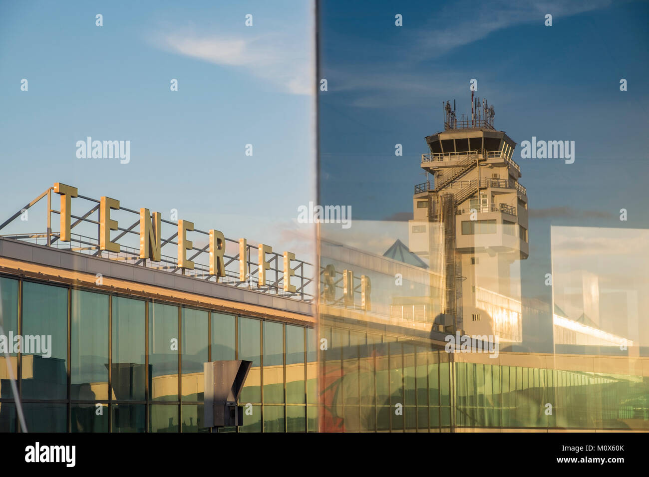 Tenerife Sur airport, control tower, name sign, airside through glass window of boarding gate, Reina Sofia, Canary Islands, Spain Stock Photo