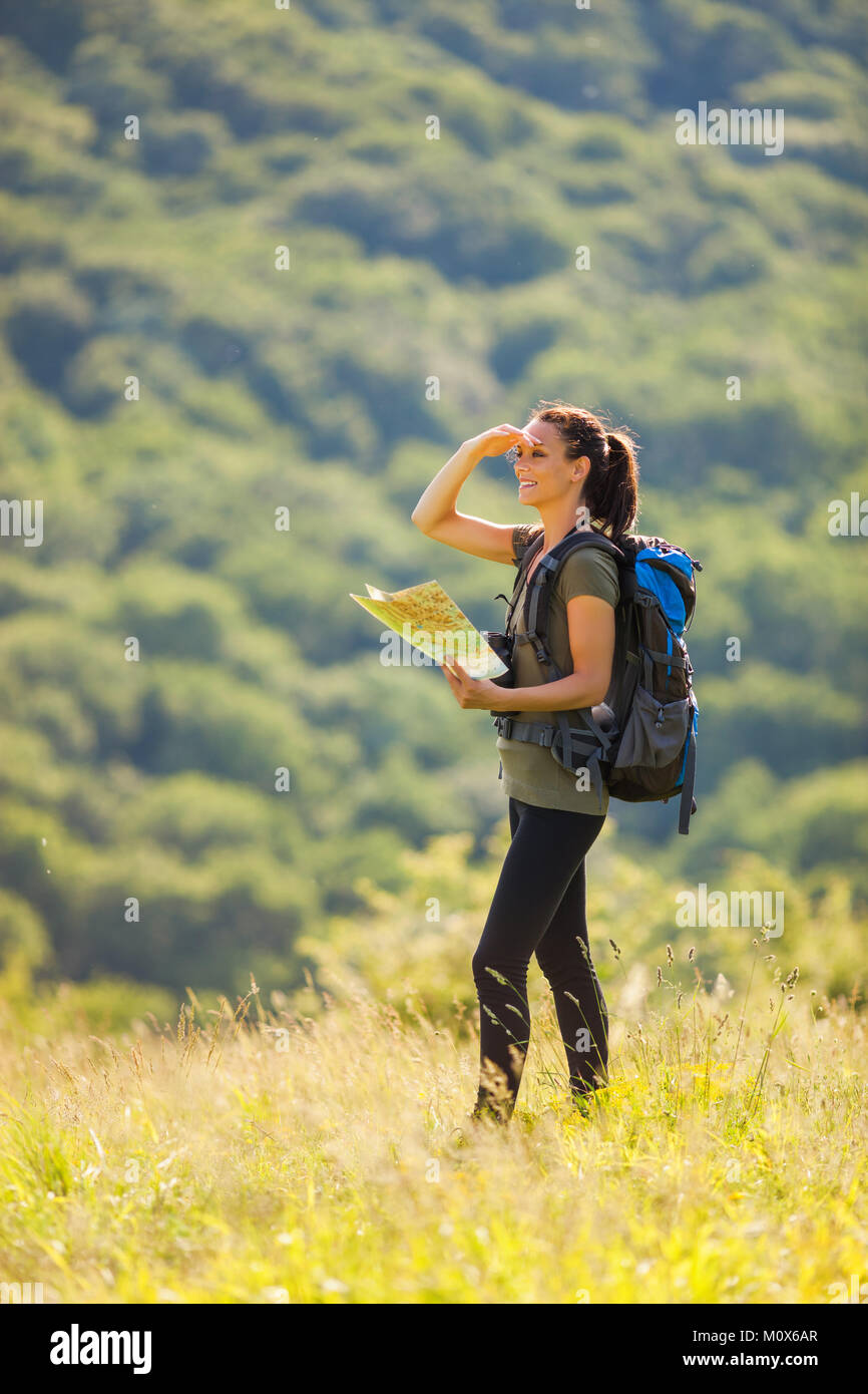 Young woman hiking map nature hi-res stock photography and images - Alamy