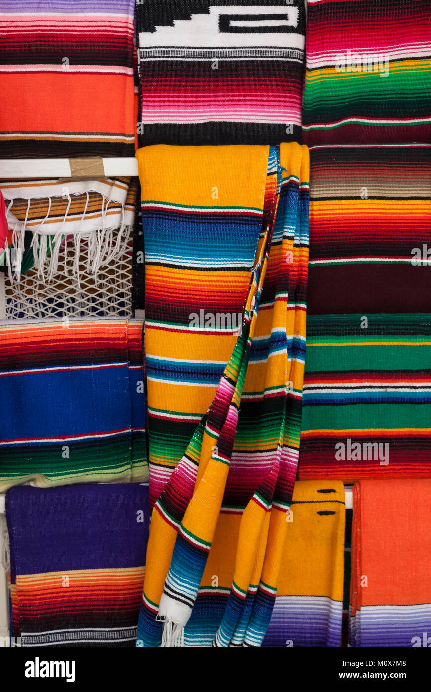 Close up of a  colourful selection of Sarapes hanging up in Market 28, Cancun, Yucatán Peninsula, Mexico Stock Photo