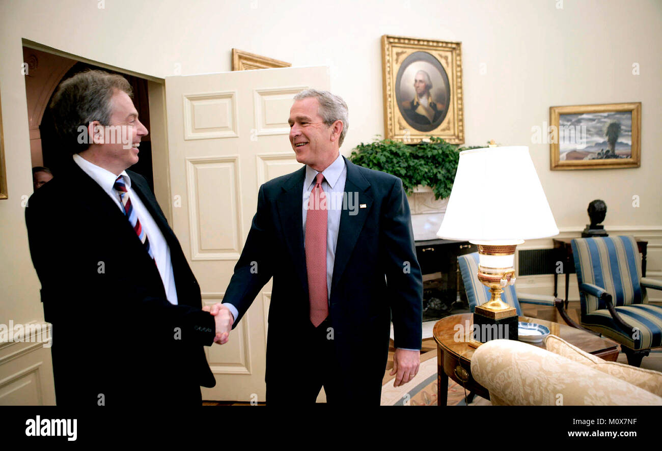 Washington, D.C. - May 26, 2006 -- United States President George W. Bush greets Prime Minister Tony Blair of Great Britain in the Oval Office of the White House, Friday, May 26, 2006, during the second day of the Prime Minister's two-day visit. .Credit: Eric Draper - White House via CNP/ MediaPunch Stock Photo