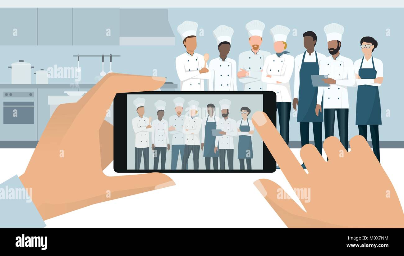 Professional chefs posing in the restaurant kitchen, a man is taking a picture using a smartphone, subjective point of view Stock Vector