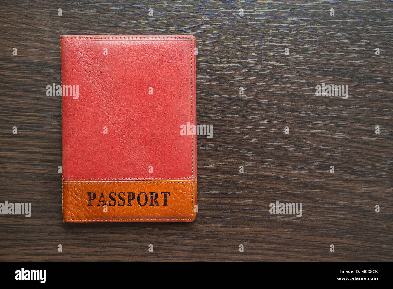 passport in orange leather cover on a table Stock Photo - Alamy