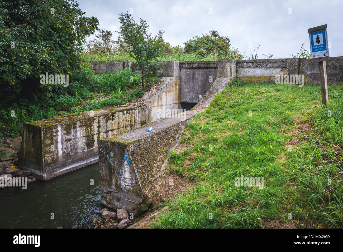 A unique crossing of two small water canals built on the turn of 19th and 20th centuries in Silice village, Warmian-Masurian Voivodeship of Poland Stock Photo
