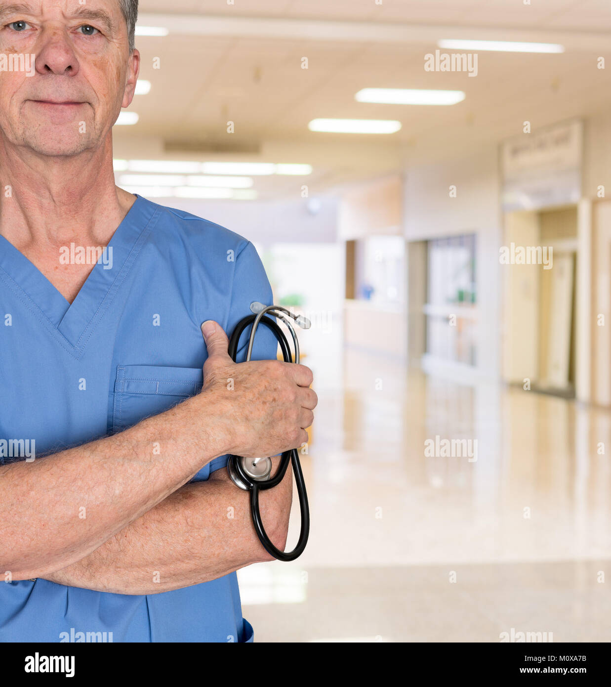 Senior medical consultant in blue scrubs Stock Photo
