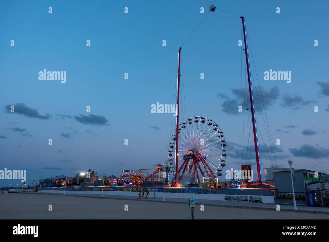 Evening view of the Slingshot in the Jolly Roger at the Pier amusement