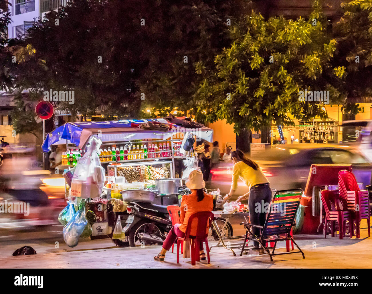 Street vendors operating at riverside Phnom Penh Cambodia Stock Photo