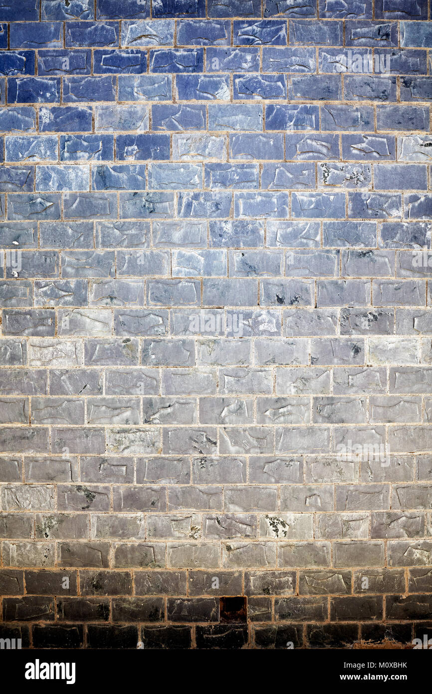 Old stained stone brick wall background or texture. Stock Photo