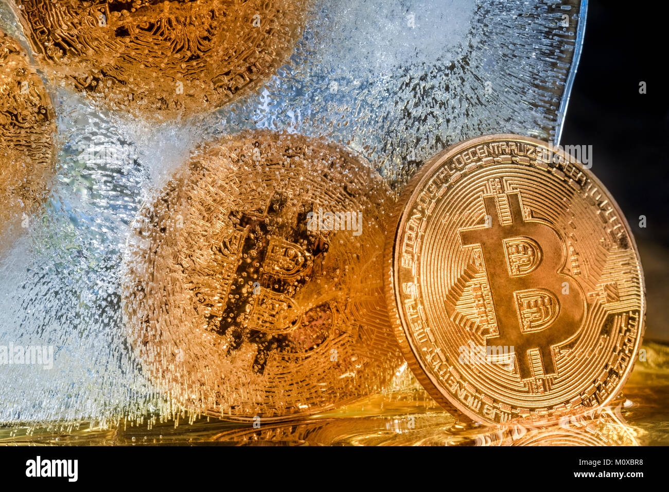 View Of Golden Coins Of Bitcoin Cryptocurrency Frozen In Ice Stock Photo Alamy