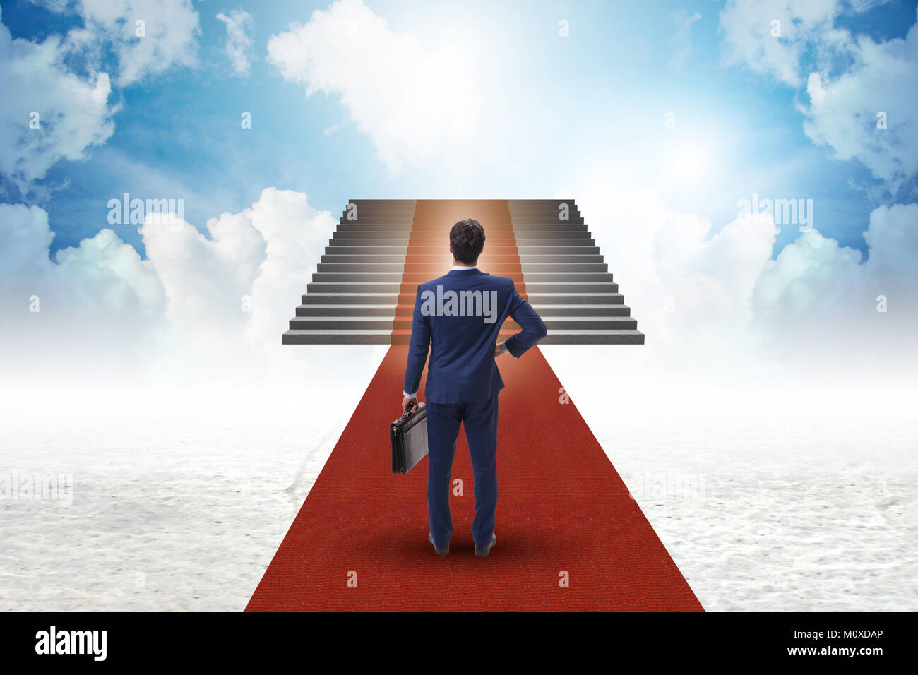 Young businessman climbing stairs and red carpet into sky Stock Photo ...