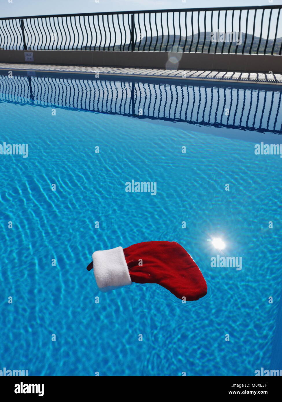 christmas decoration swimming on the water of a pool  Stock Photo