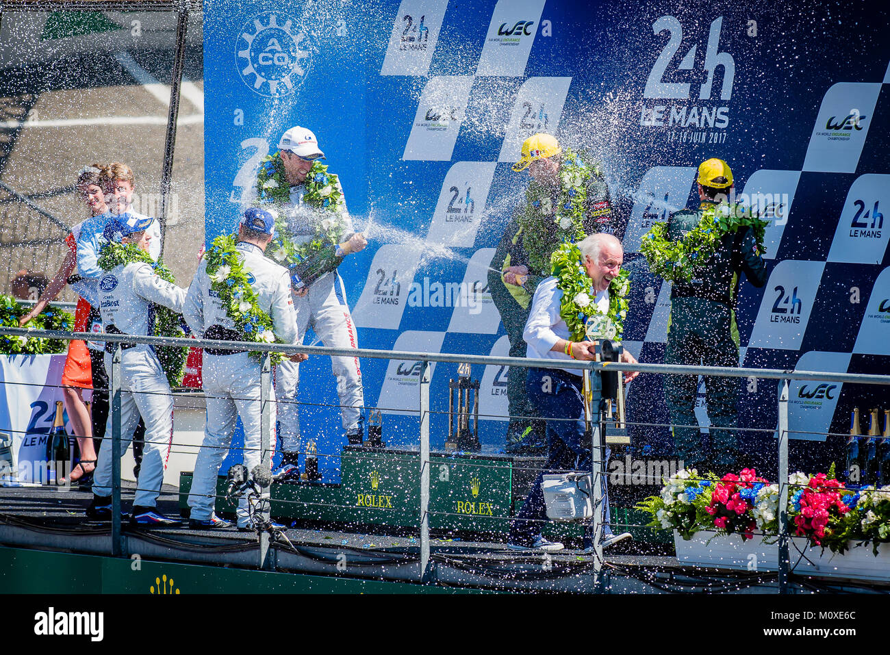 Trophy presentations & Champagne spraying on the podium for the Winners of the 2017 24 Hours Le Mans at Circuit de la Sarthe on Sunday 18 June 2017. Stock Photo