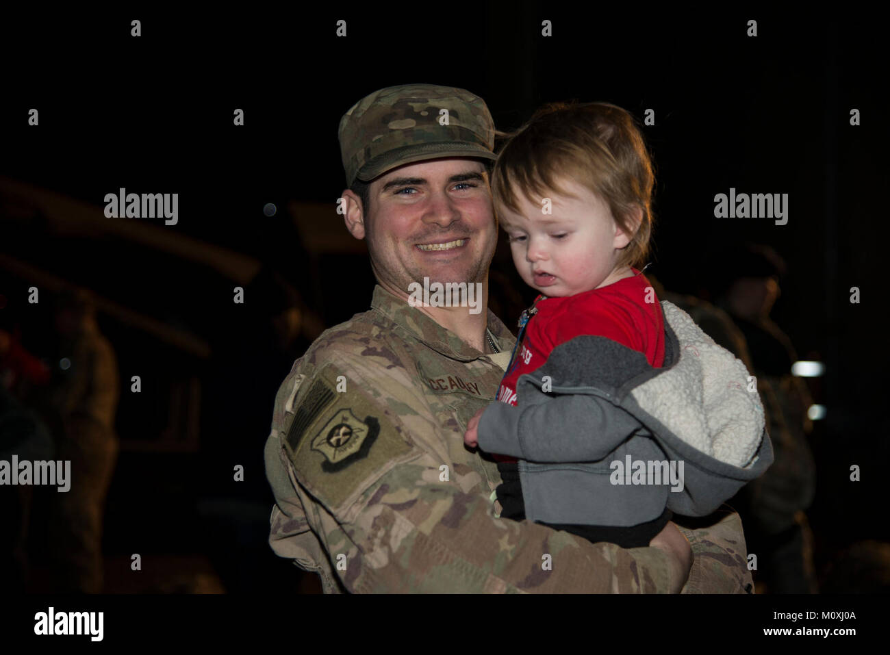 Staff Sgt. Issac McCauley, 436th Security Forces Squadron defender, holds Jaxon, his son, after returning home from deployment Jan. 21, 2018, at Dover Air Force Base, Del. McCauley is one of twelve defenders sent to the Middle East for a six-month deployment. (U.S. Air Force Stock Photo