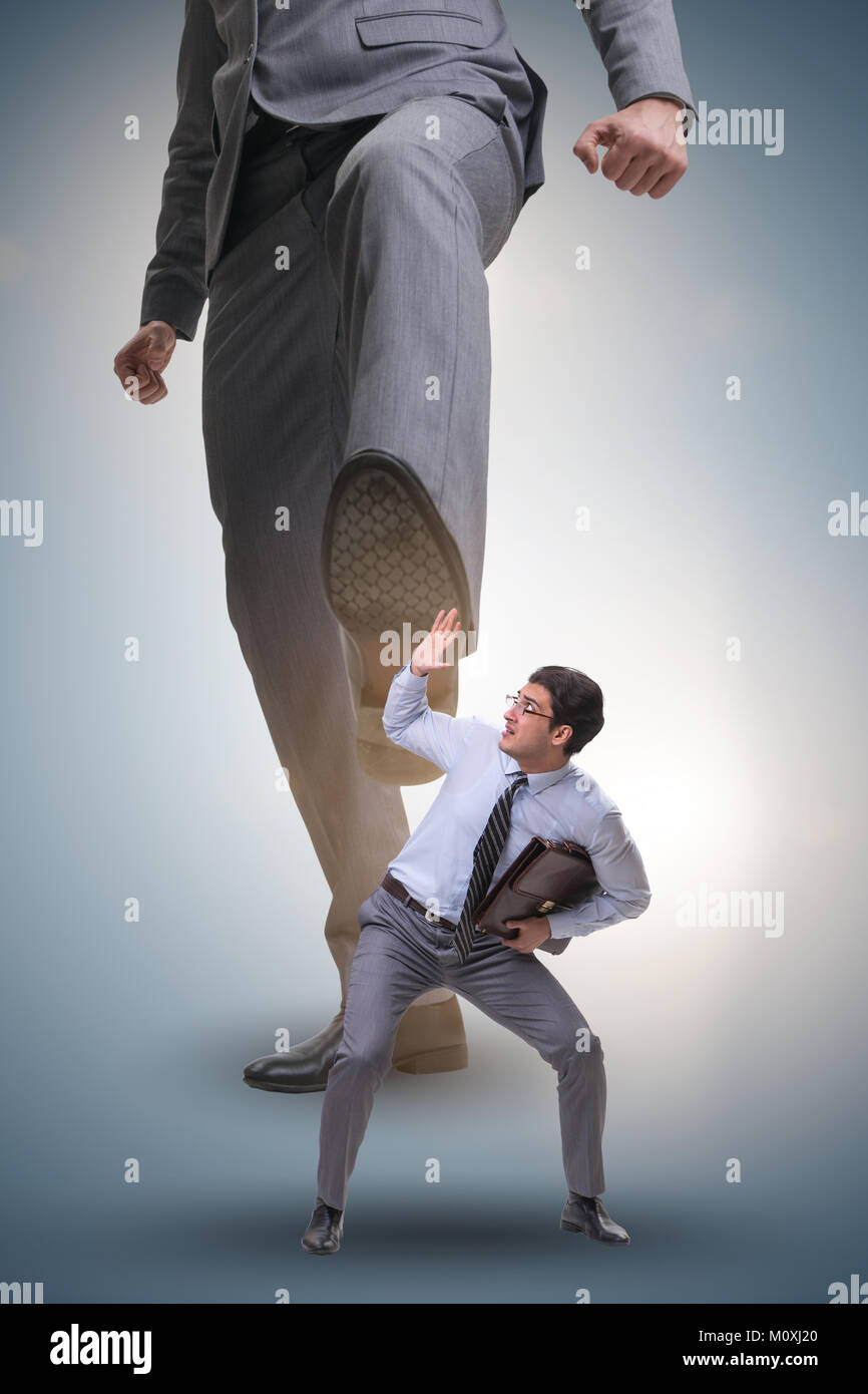Bad angry boss kicking employee in business concept Stock Photo - Alamy
