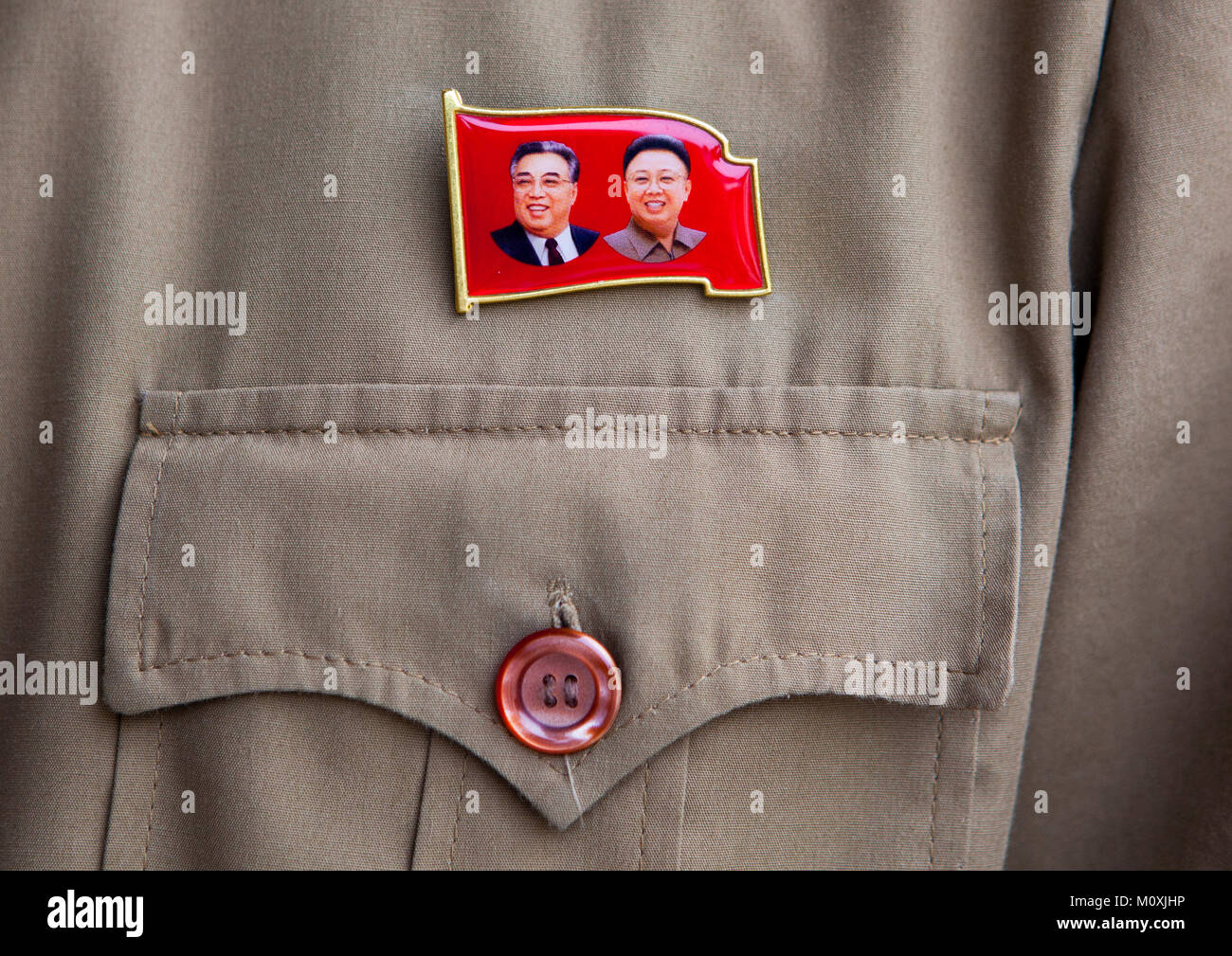 Dear Leaders badge on the shirt of a worker, North Hwanghae Province, Panmunjom, North Korea Stock Photo