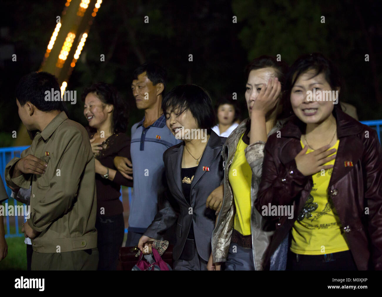 North Korean people with nausea coming down from a roller coaster in
