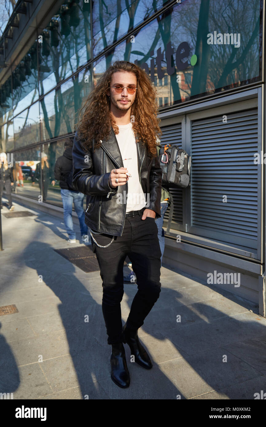 MILAN - JANUARY 13: Man with black leather jacket and long hair before  Emporio Armani fashion show, Milan Fashion Week street style on January 13,  201 Stock Photo - Alamy