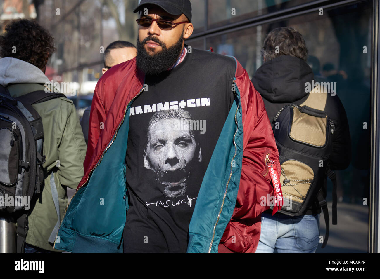 MILAN - JANUARY 14: Man with Alpha Industries blue bomber jacket and red  Louis Vuitton Supreme pouch before MSGM fashion show, Milan Fashion Week  stre Stock Photo - Alamy