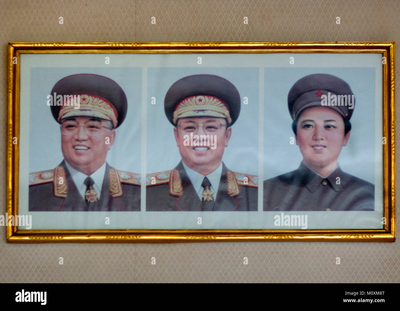 Official portraits of the Dear Leaders and Kim Jong suk in military uniforms, North Hamgyong Province, Jung Pyong Ri, North Korea Stock Photo