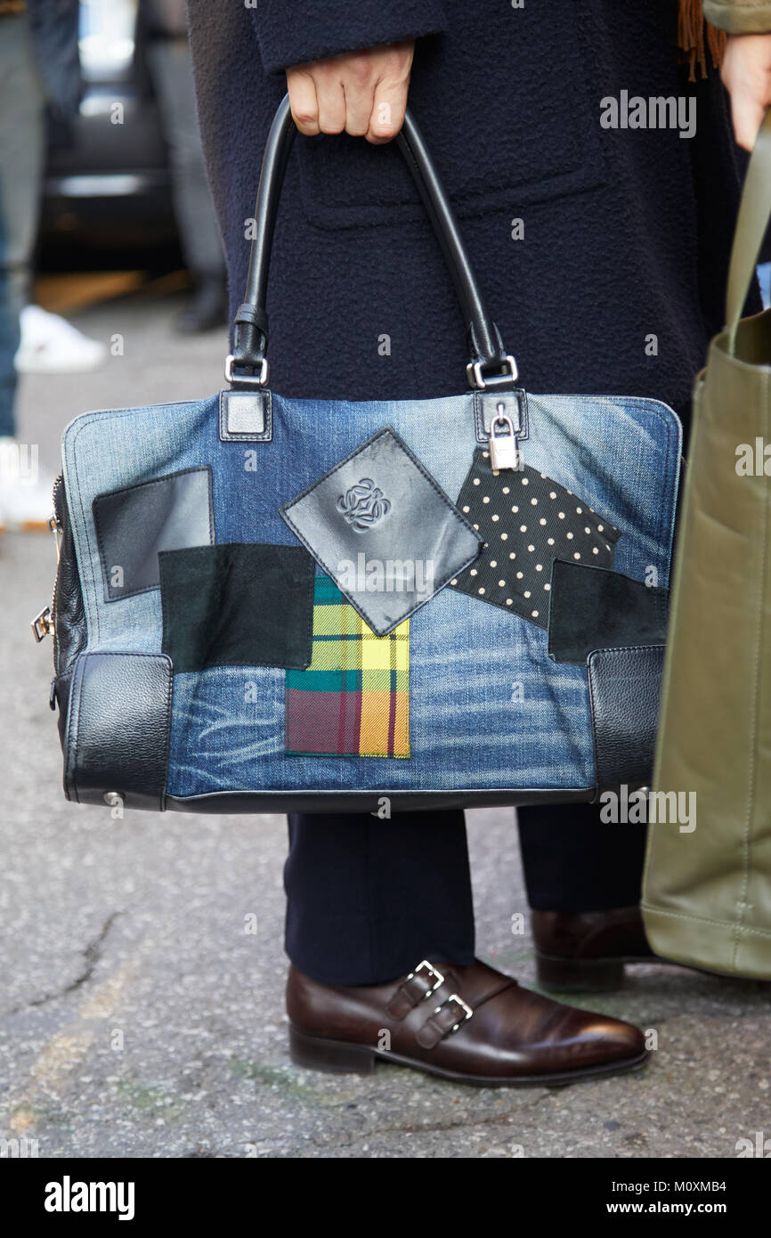 Woman with black leather Marni bag before Marni fashion show