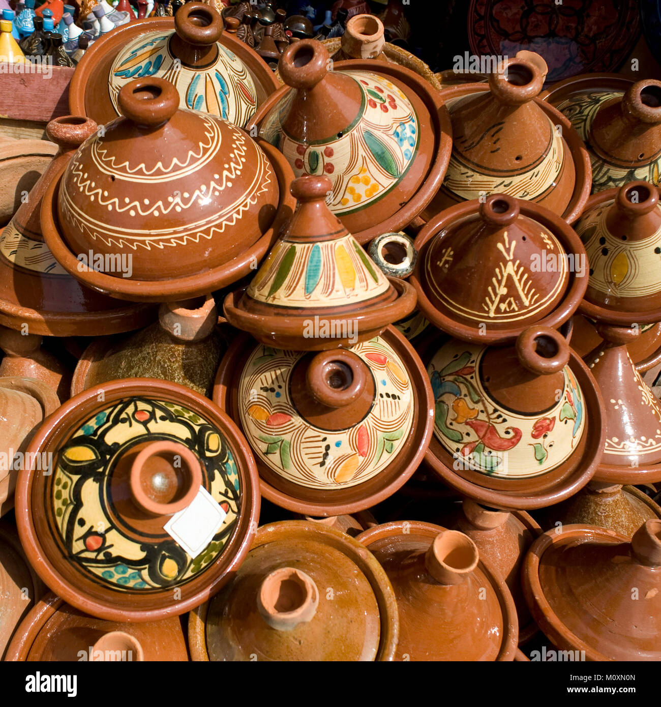 Selection of colorful Moroccan tajines. Traditional dish, meat and vegetable in ceramic tajine. Stock Photo