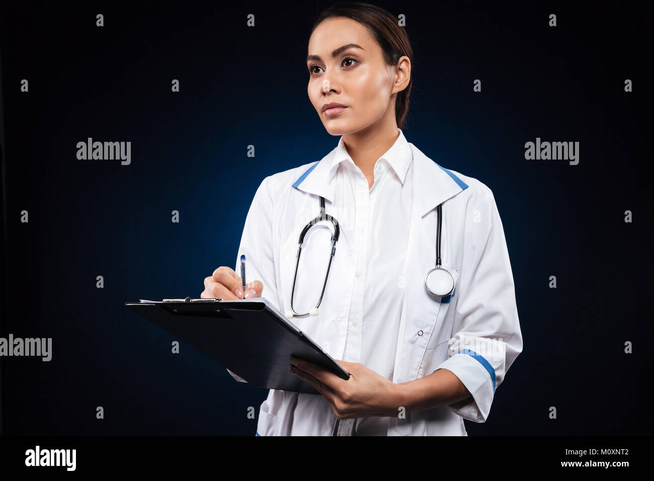 Nurse doctor looking in folder hi-res stock photography and images - Alamy