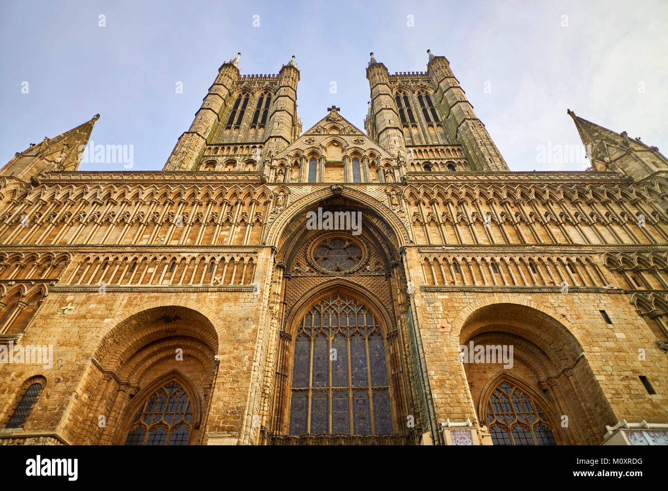 Exterior looking up at the two west towers of Lincoln Cathedral Stock Photo