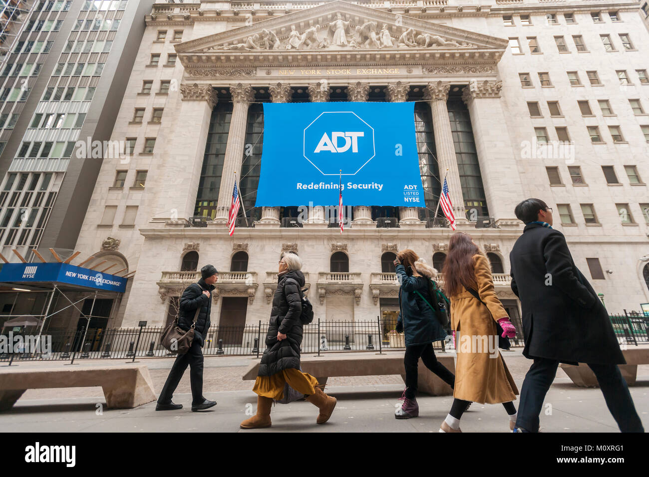 The New York Stock Exchange is decorated for the first day of trading for  ADT, seen on Friday, January 19, 2018. ADT, Inc. markets home and business security products and was bought by private-equity firm Apollo Global Management in 2016 and now is returning it to a public company.  (Â© Richard B. Levine) Stock Photo
